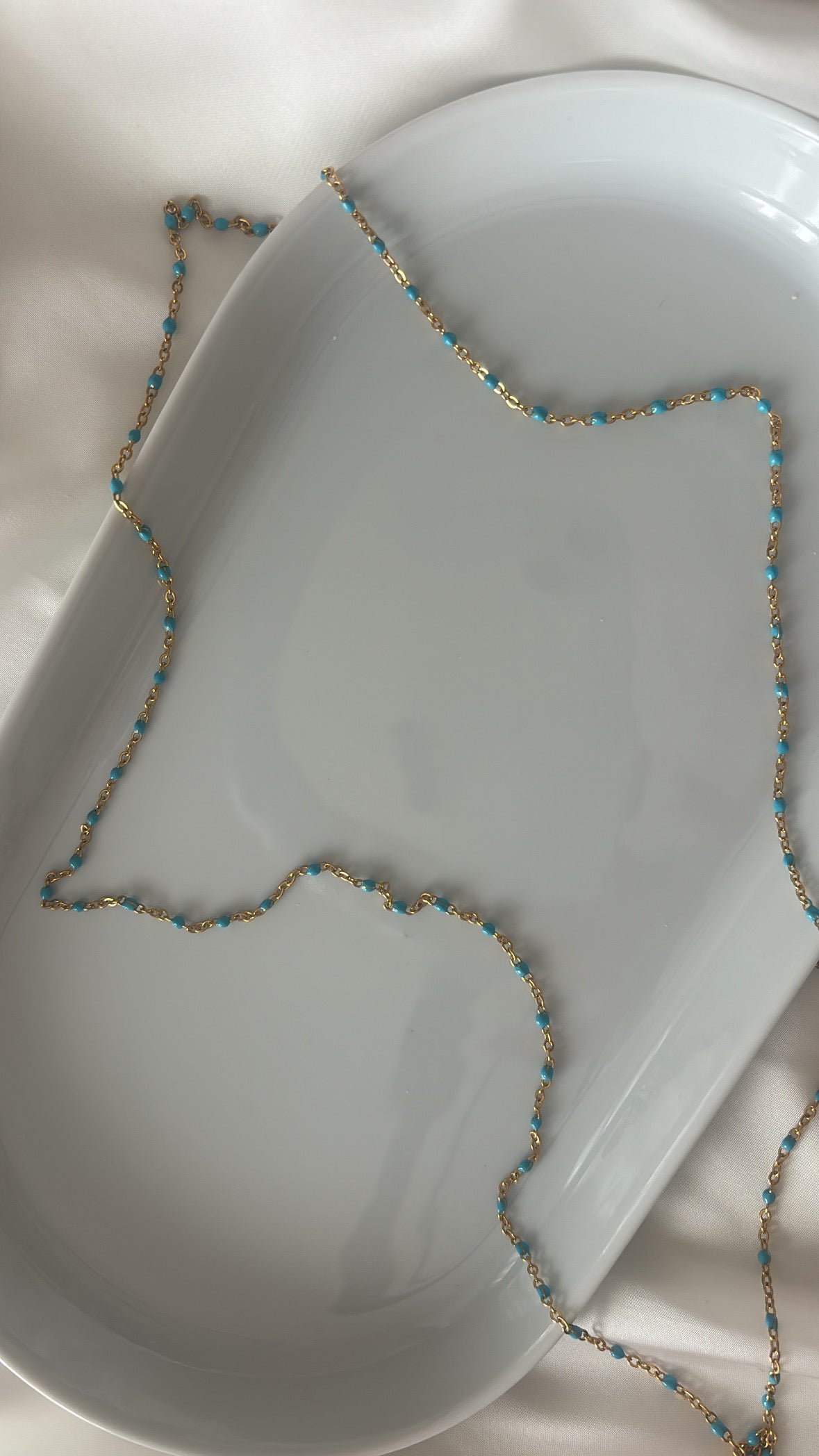 Chaîne à perles bleu clair