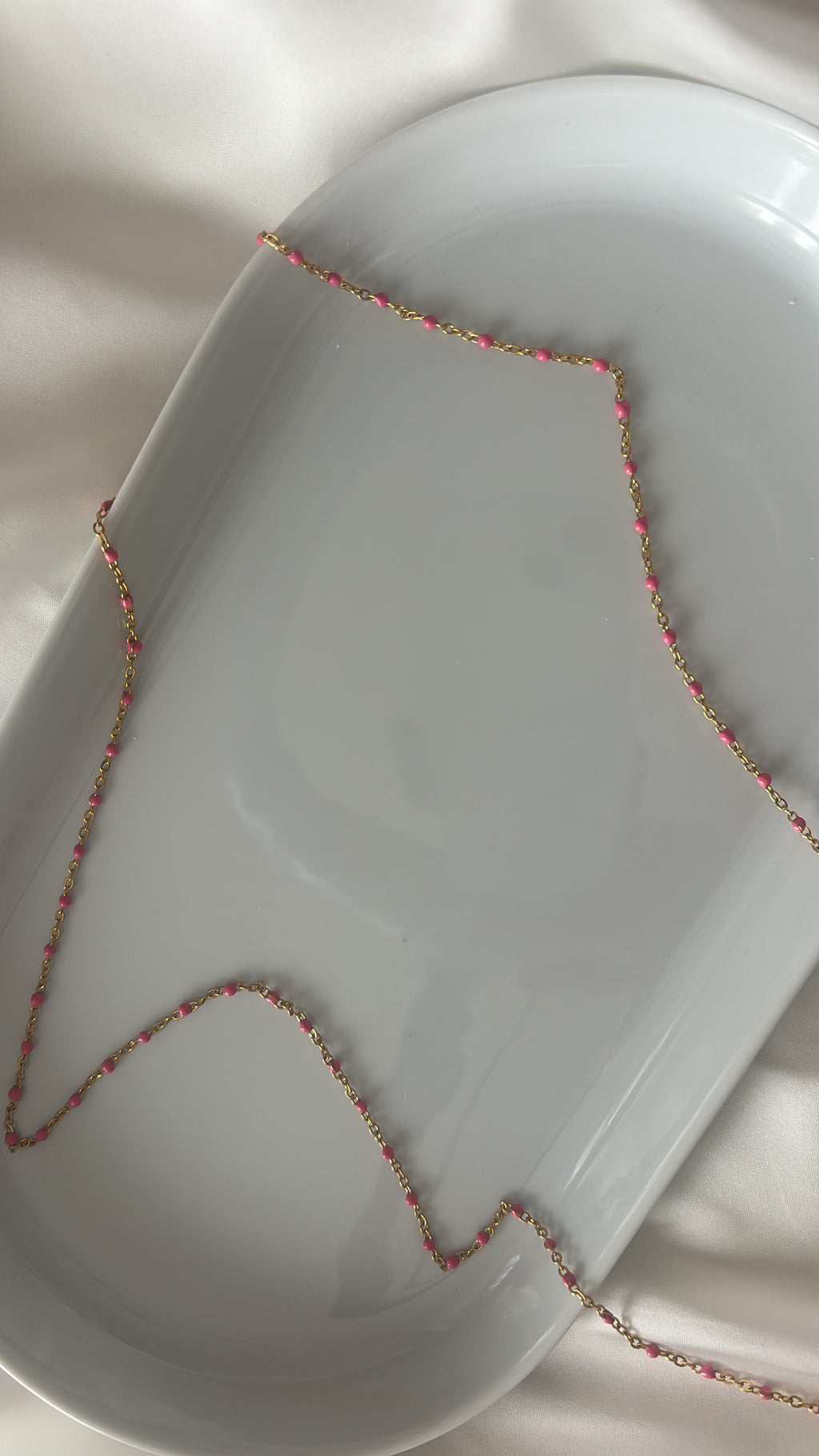 Chaîne à perles roses