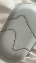 Chaîne à perles violettes